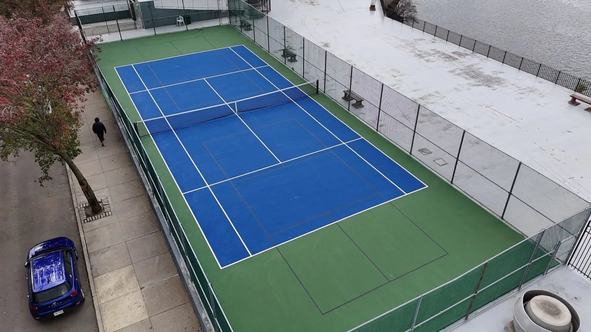 The same court resurfaced in blue and green with fresh white lines and a new net